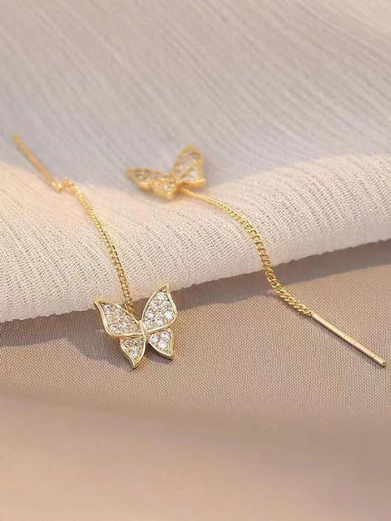 Hilo de oreja de mariposa con diamantes de imitación y borla caprichosa